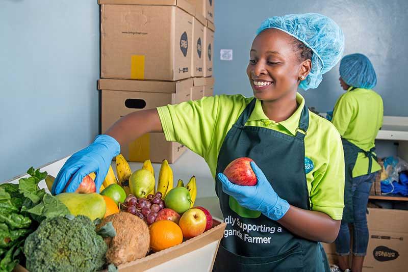 Staff at Bringo Fresh prepare orders in Kampala, Uganda.