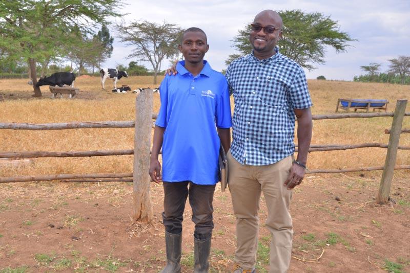 Nathan Were, meeting one of the dairy extension executives.