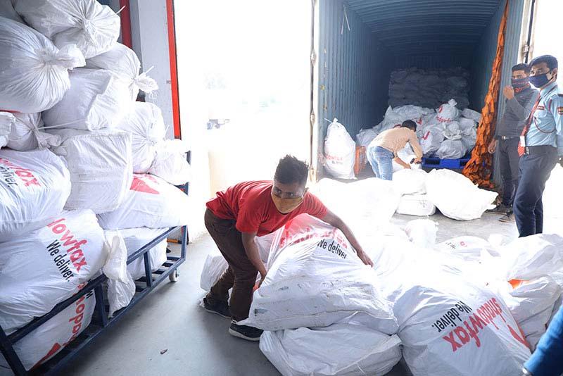 A Shadowfax employee unloads a truck in the Bengaluru delivery center.